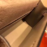 Mauve Ostrich-Embossed Top-Handle Bag